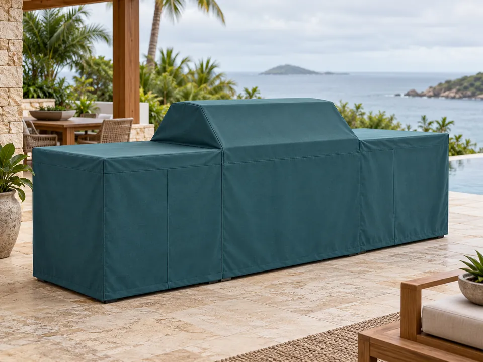 Fitted outdoor kitchen cover on a coastal patio